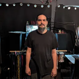 Stephen standing in his office