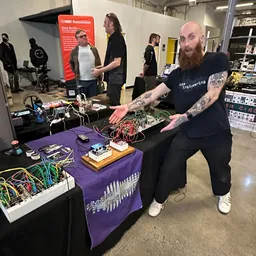 Markus shows off some pedals at a show.